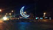 A decorated and illuminated crescent statue in Jordan