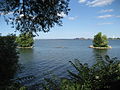 Large body of water, with land reclamation islands.