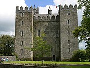 A big tower house with square corner towers.