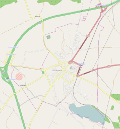 Mapa konturowa Olsztynka, w centrum znajduje się ikonka zamku z wieżą z opisem „Zamek w Olsztynku”