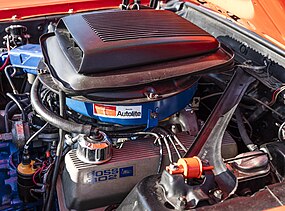 Ford Boss 302 Engine With Shaker scoop. Factory Finned Aluminum valve covers unique to canted valve Boss 302 engine.