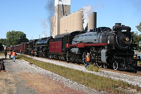 Milwaukee Road 261 behind Canadian Pacific 2816 in a rare steam doubleheader excursion at a service stop in Red Wing, Minnesota.