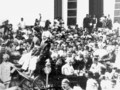 Mohandas Karamchand Gandhi (seated in carriage, on the right, eyes downcast, with black flat-top hat) receives a big welcome in Karachi in 1916 after his return to India from South Africa.