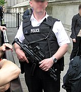 Police officer from Met police London England Uk at Downing Street security holding an MP5A3