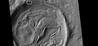 Crater floor with the shape of an odd face, as seen by HiRISE under HiWish program. The box indicates where the next picture is located.