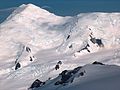 Great Needle Peak from Miziya Peak, with Sliven Peak and Atanasov Nunatak in the foreground, Huron Glacier with Kukeri Nunataks and Nestinari Nunataks in the middle, and Great Needle Peak and St. Ivan Rilski Col surmounting Plana Peak and Kardam Buttress in the background