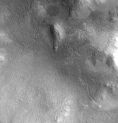 Lyot crater channel, as seen by CTX. Water-carved channels have been spotted in Lyot crater; the curved line may be one.