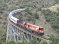 A regional train crossing a trestle.