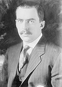 Publisher Edward Beale McLean wearing a three-piece striped suit with a spread-collar shirt, 1924.