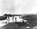 Soldiers unloading landing craft on the beach at Massacre Bay, Attu, on 12 May 1943.