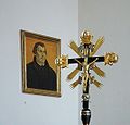 Processional crucifix with the portrait of Martin Luther at Saint George's Lutheran church in Immeldorf, Lichtenau