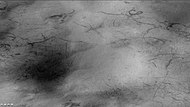 Weinbaum crater region showing dust devil tracks, as seen by CTX camera (on Mars Reconnaissance Orbiter). Field of picture is just outside rim of crater and is an enlargement of the previous image of Weinbaum crater.