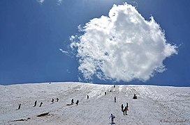 People sliding on the snow in Pooladkaf