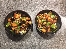 A Northeast China dish with fried eggplant, bell pepper, and potato.