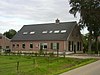 Boerderij op huisterp, voormalige woning van een radmaker