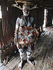 Asmat tribesman in Syuru village at Agats