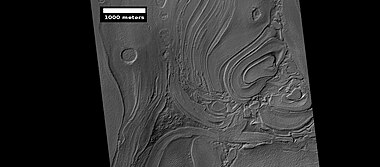 Close-up of banded terrain on the floor of the Hellas basin, as seen by HiRISE. Other, previous photos show wide views of this region.