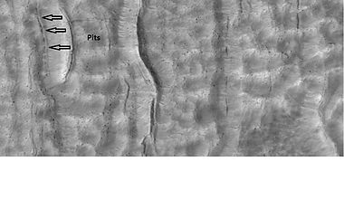 Pits that seem to be forming cracks, as seen by HiRISE under HiWish program