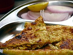 Stuffed Bengali-style paratha served in a restaurant in Mumbai, India