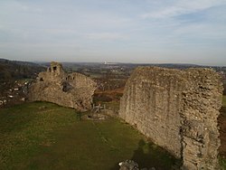 A ruined wall on a hilltop.