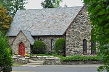 Stone English Gothic-style church with red door