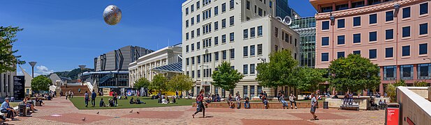 view of people enjoying sunshine in city square