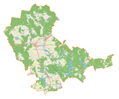 Mapa konturowa gminy Olsztynek, blisko centrum na lewo znajduje się ikonka zamku z wieżą z opisem „Zamek w Olsztynku”