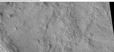 Field of low center polygons near crater, as seen by HiRISE under HiWish program. These features are common where the ground freezes and thaws.