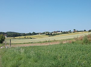 Photograph shows rolling hills.