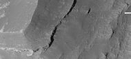 Enlargement of edge of mesa on floor of Noctis Labyrinthus showing layers, as seen by HiRISE under HiWish program. Note: this is an enlargement of a previous image.