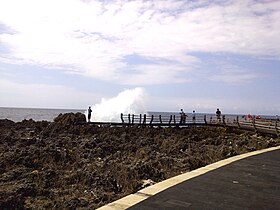 Geyser-like sea wave at one of two islets in Nusa Dua