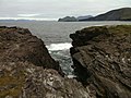 View from Culloo Rock. Dingle Peninsula, Dingle Bay and the north shore of Valentia Island (including Fogher Cliffs) are in the background.