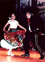 Jarabe Tapatío in the traditional China Poblana dress.