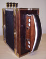 The front left-hand side (bass side) of a Cajun accordion