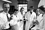 Nobel Prize winner Robert W. Holley (left) and team members determine the molecular structure of RNA.