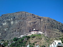 White coloured temple shrine located in the hill.