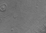 Close up image of Phaethontis surface taken with Mars Global Surveyor. Holes are thought to be caused by buried ice turning into a gas.