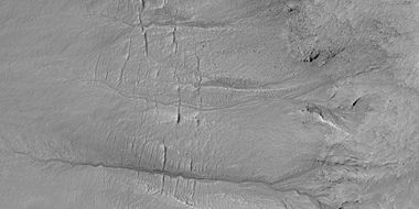 Close view of gully channels, as seen by HiRISE under HiWish program. Channels make some tight curves.