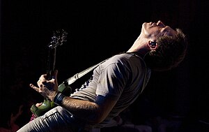 Kessler performing with Blondie during their 2010 Endangered Species World Tour