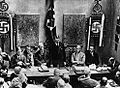 Image 17Adolf Hitler (standing) delivers a speech in February 1925. (from 1920s)